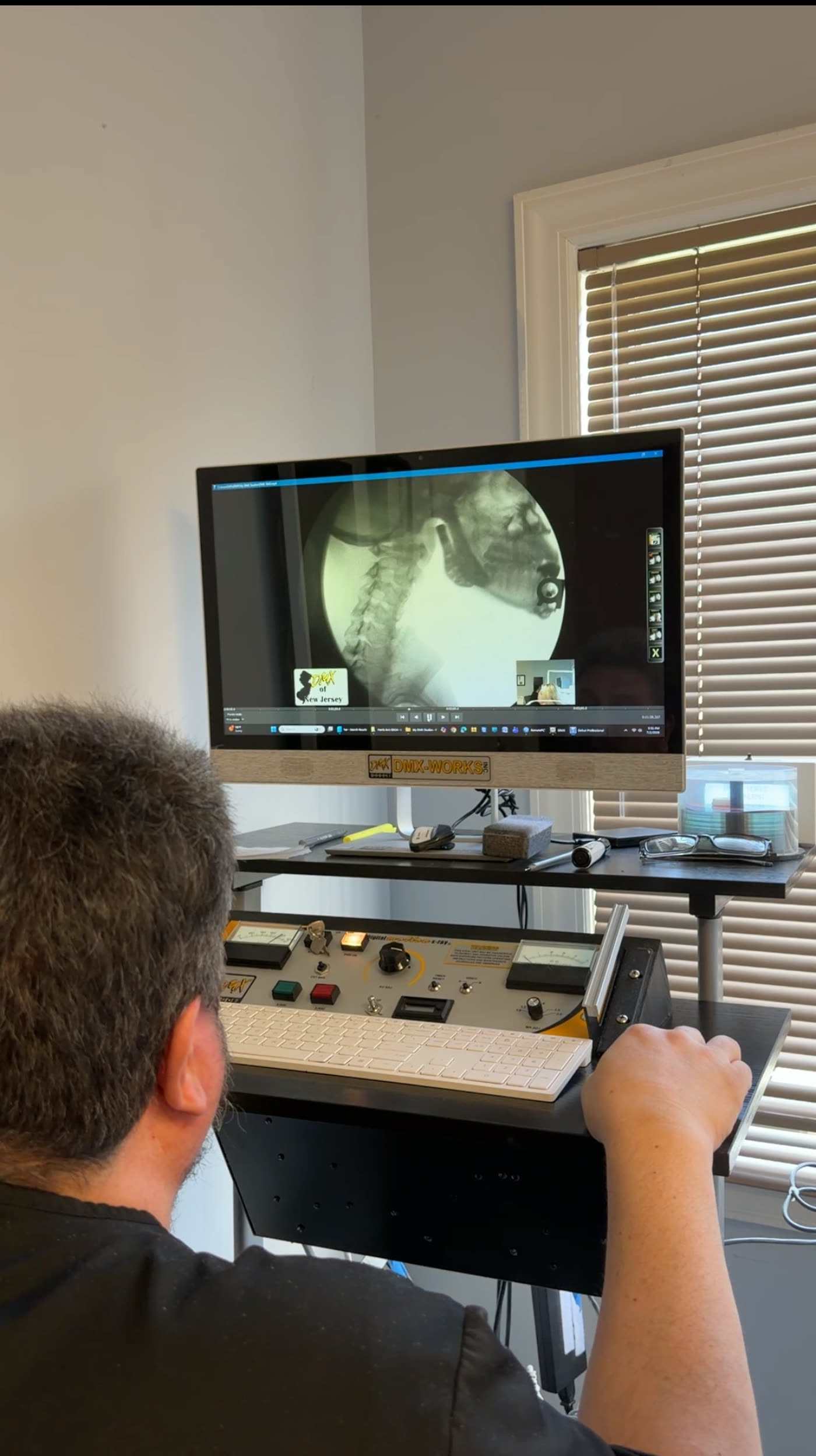 A Digital Motion X-ray study being reviewed frame by frame on screen at the office
